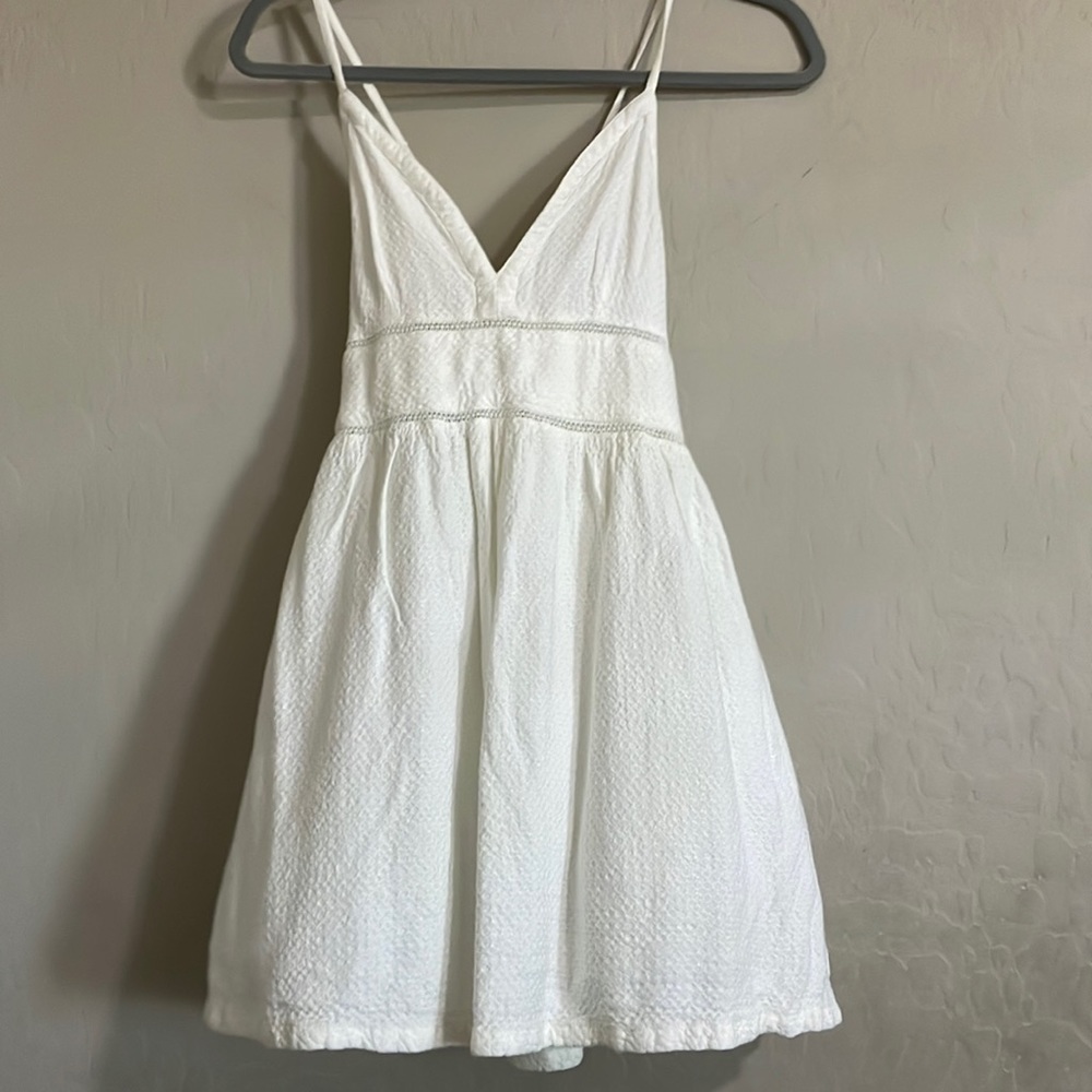 All white dress, size small, and brand is Roxy